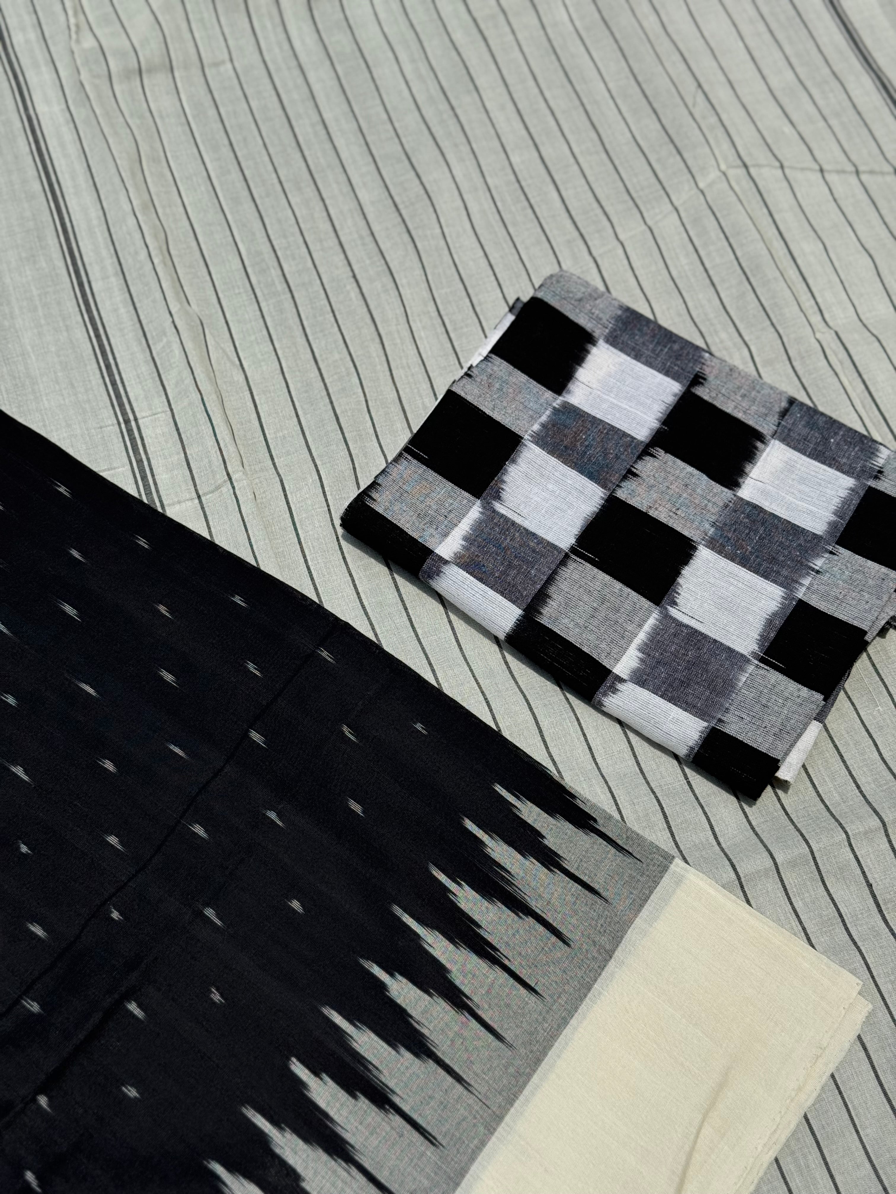 Stark black with white handwoven weft single ikkat cotton saree