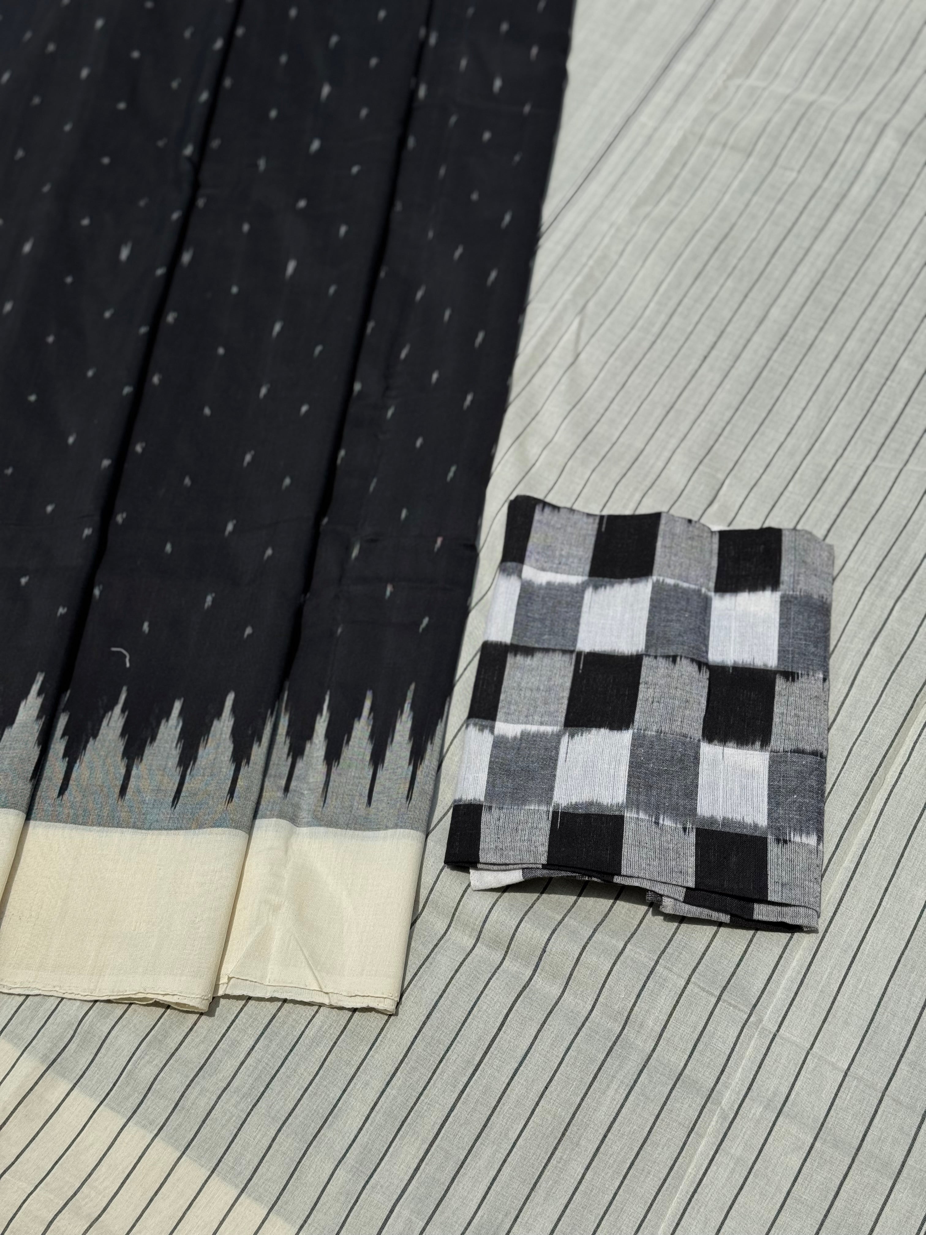Stark black with white handwoven weft single ikkat cotton saree