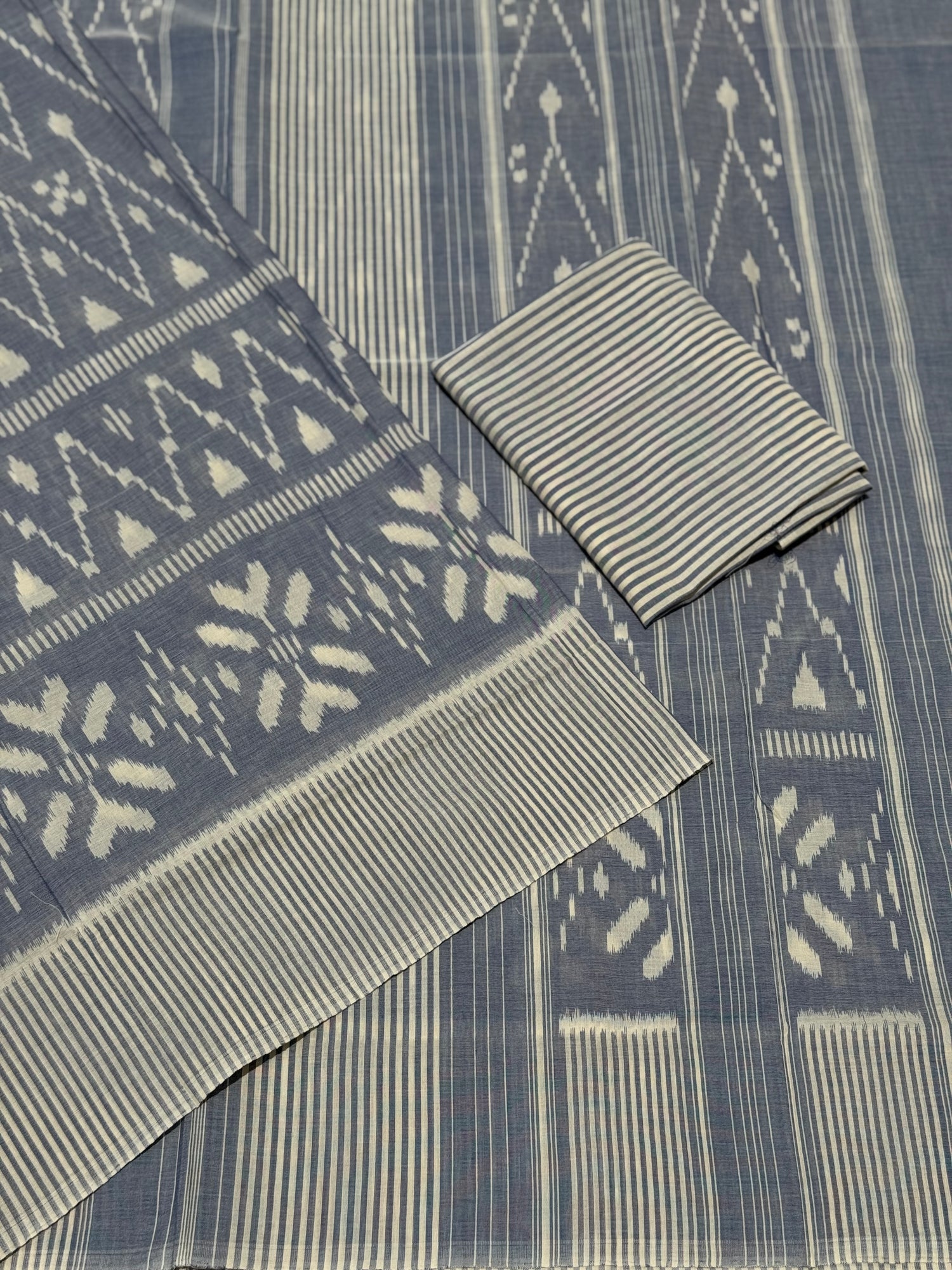 Ivory with powder blue handwoven weft single ikkat cotton saree