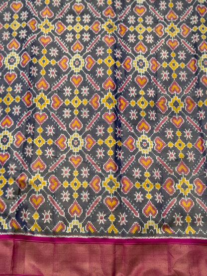 Deep bluish pink tissue patola inspired navratan ikkat design on pure mulberry silk fabric