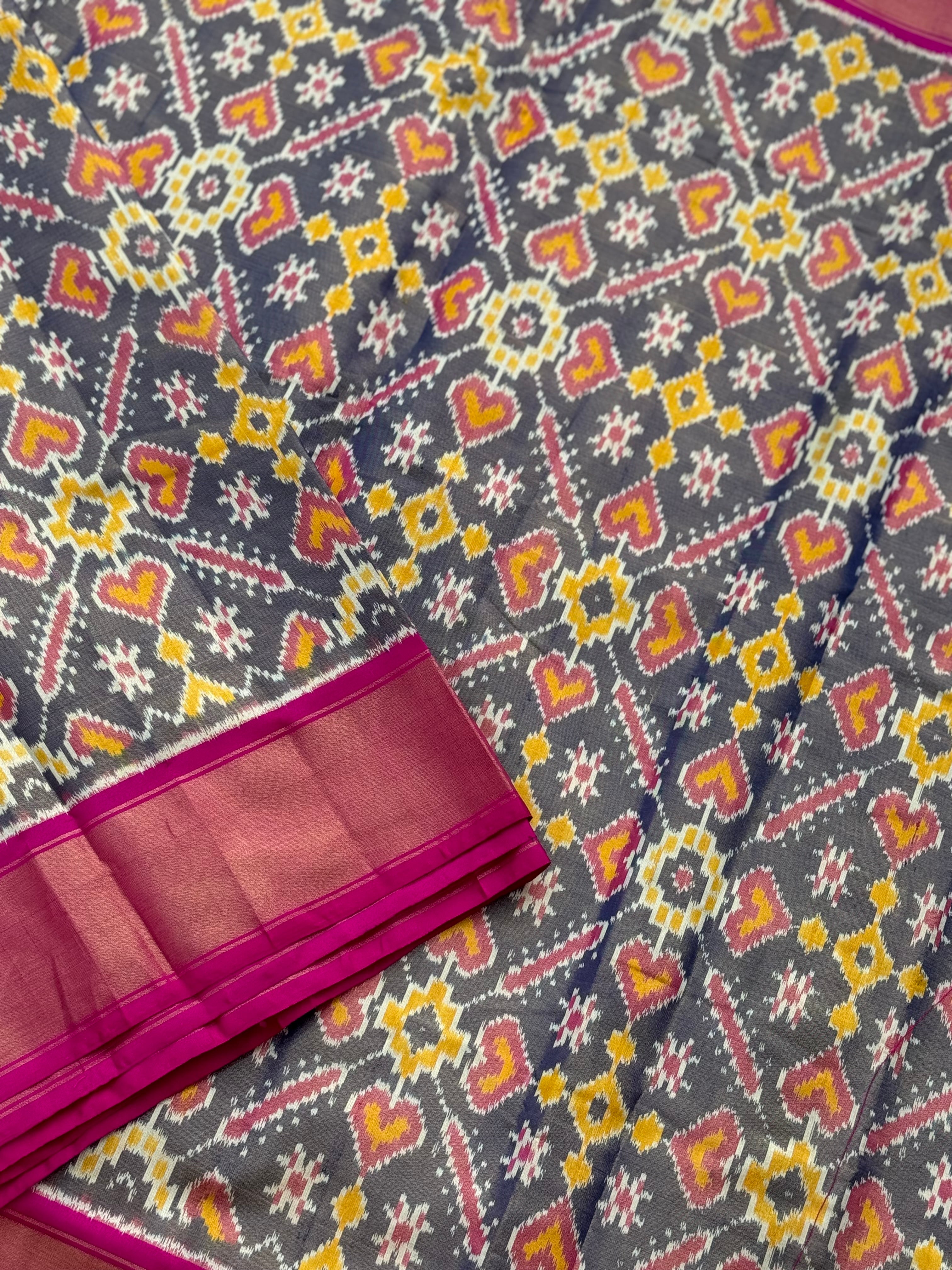 Deep bluish pink tissue patola inspired navratan ikkat design on pure mulberry silk fabric