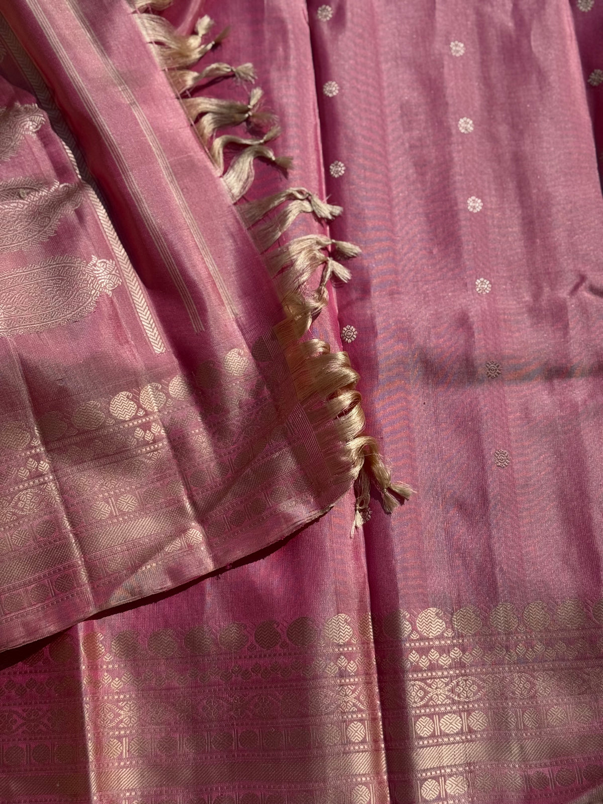 A soft and lustrous Handwoven kuttu gadwal silk saree in purple with red