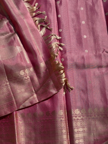 A soft and lustrous Handwoven kuttu gadwal silk saree in purple with red