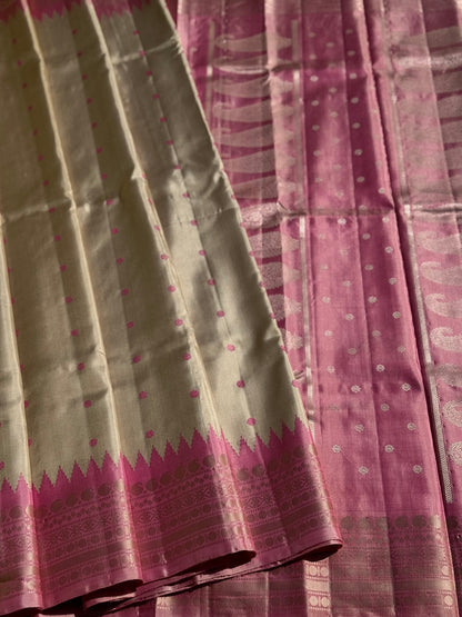 A soft and lustrous Handwoven kuttu gadwal silk saree in purple with red