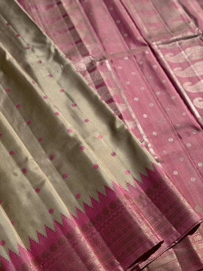 A soft and lustrous Handwoven kuttu gadwal silk saree in purple with red