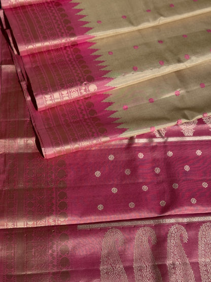 A soft and lustrous Handwoven kuttu gadwal silk saree in purple with red