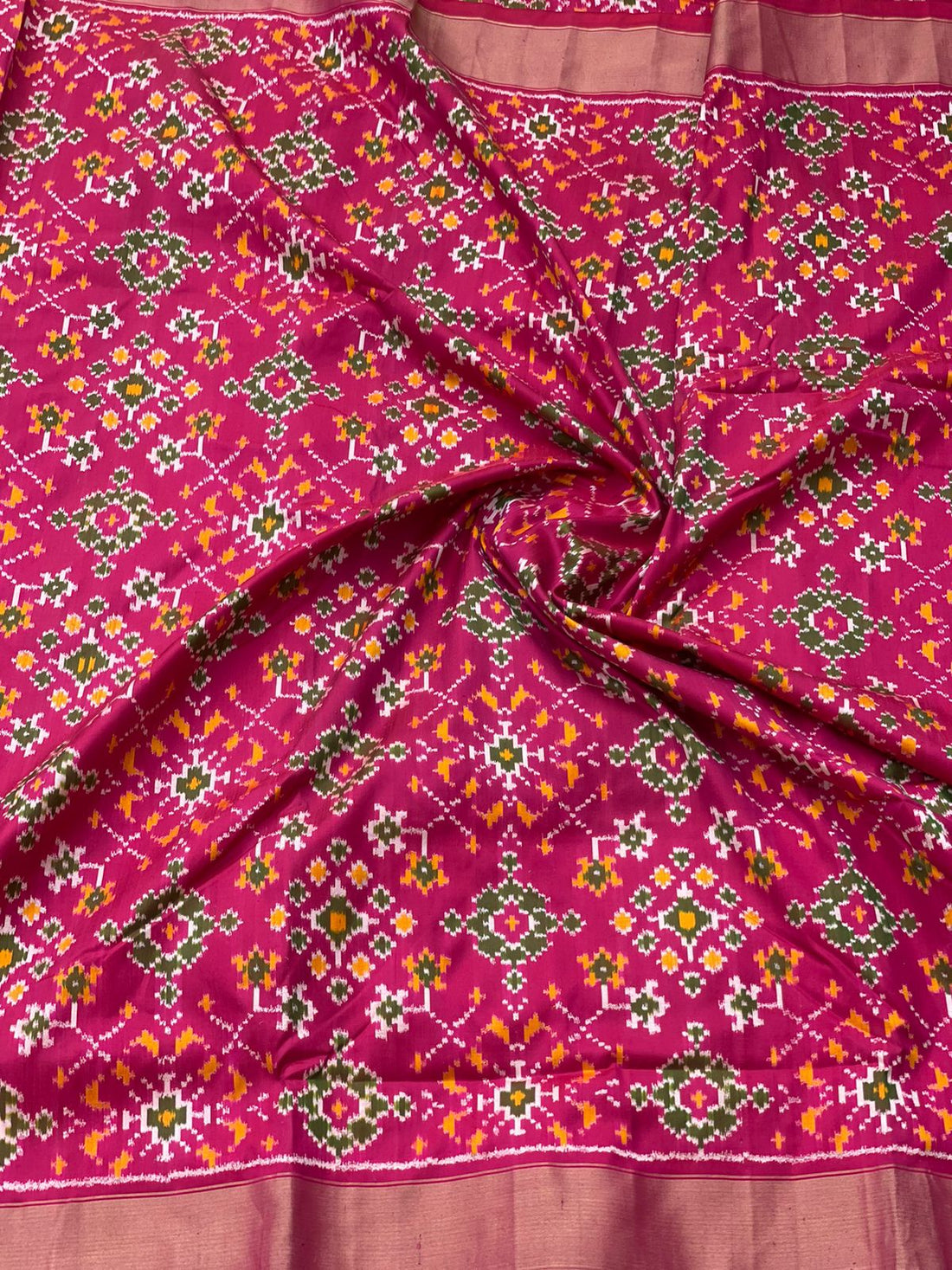 Deep Pink patola inspired navratan ikkat design on pure mulberry silk fabric