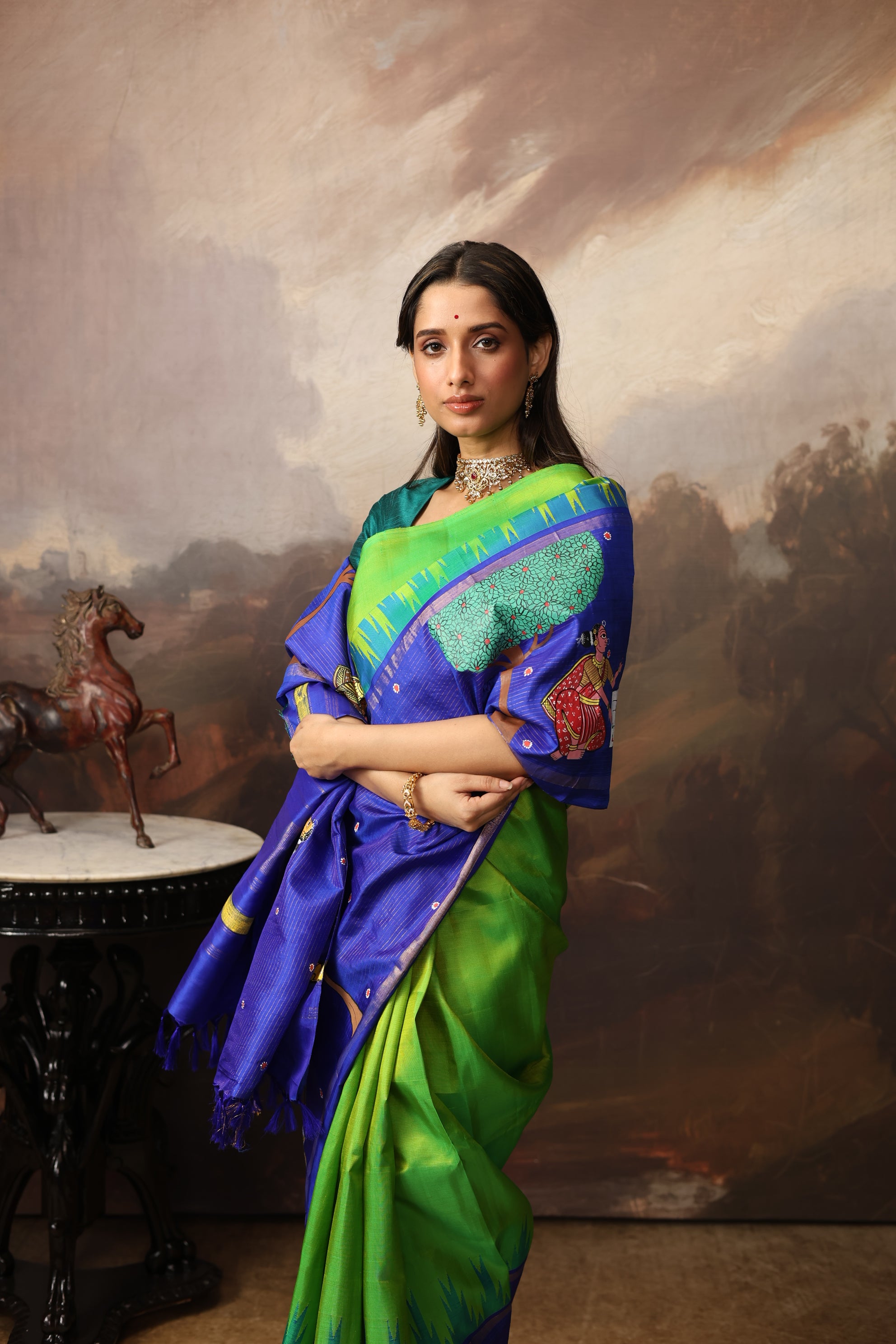 An extraordinary Cheriyal painting scroll art on a pure korvai silk kanchivaram saree