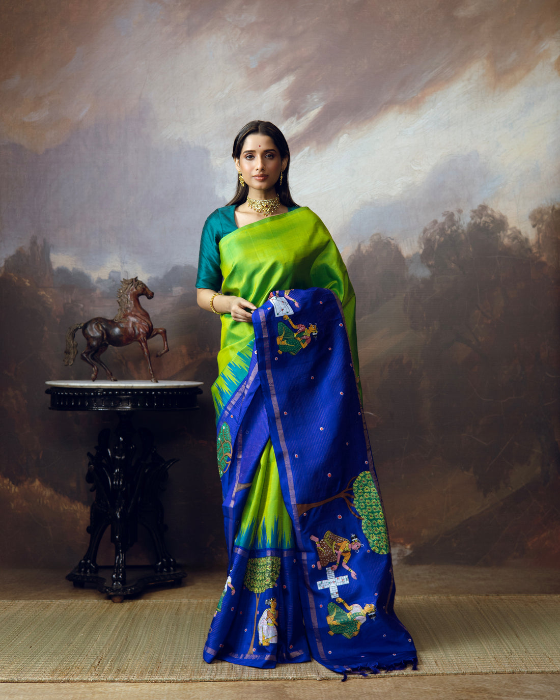 An extraordinary Cheriyal painting scroll art on a pure korvai silk kanchivaram saree